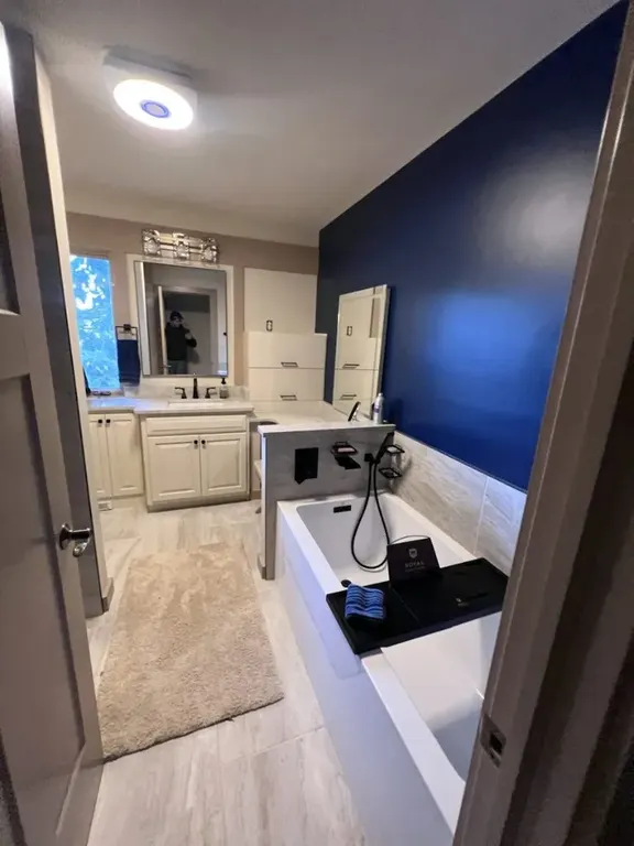 Completed Jacksonville bathroom remodel with coordinated tile, vanity, fixtures, and finishes