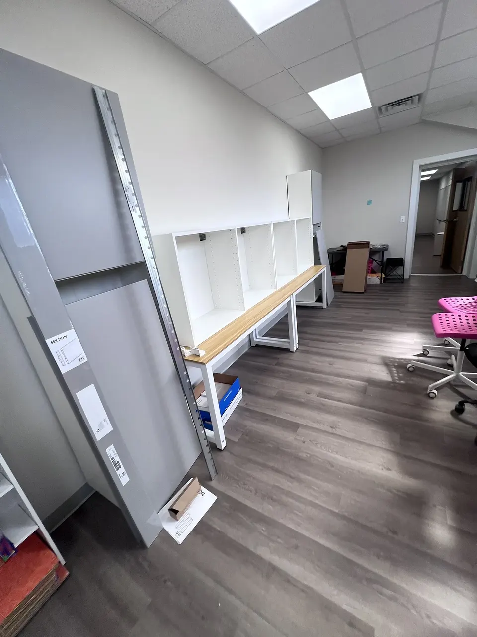 Cabinet frames aligned along the installation wall