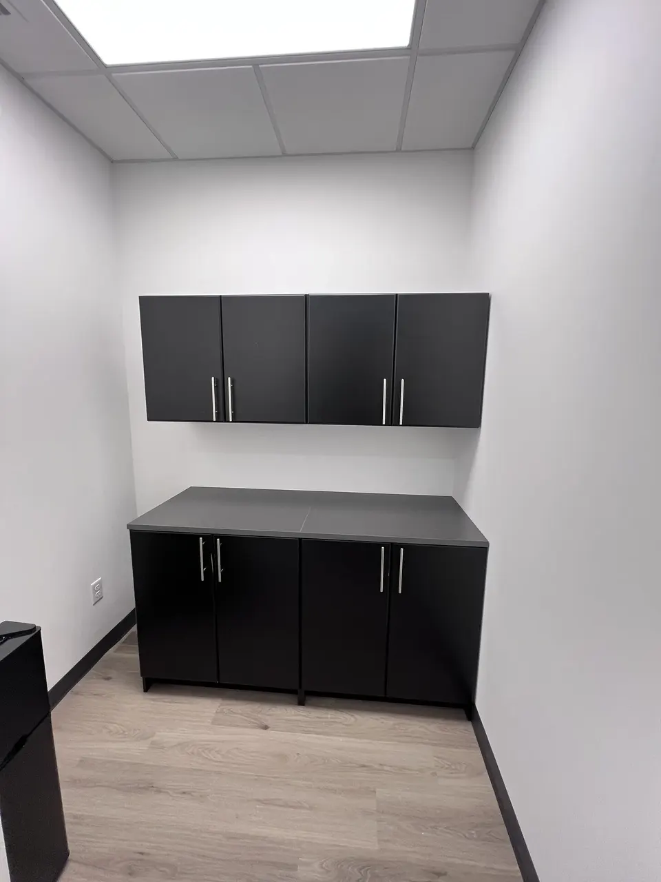 Completed secondary cabinet installation in a compact work area