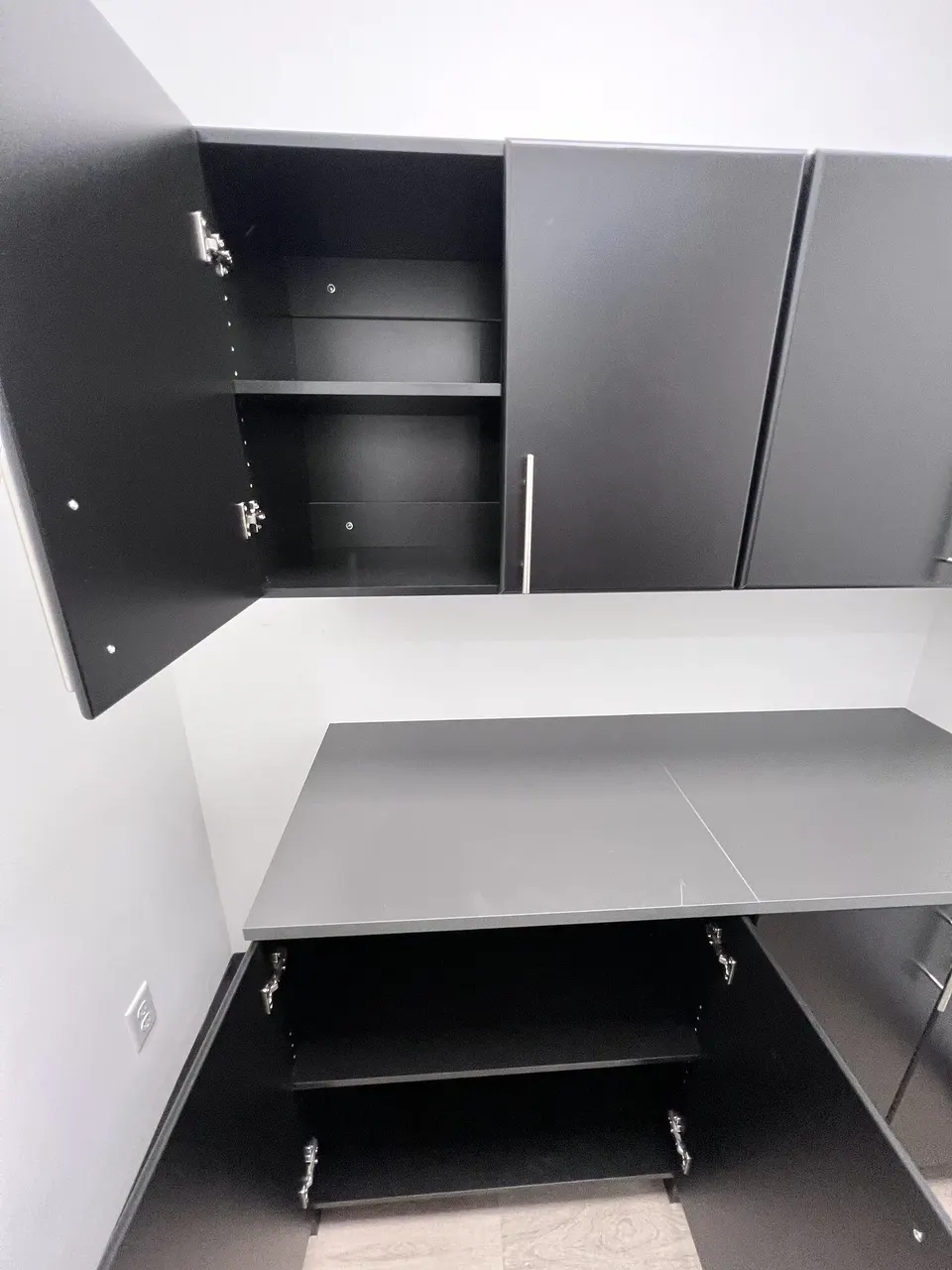 Open IKEA cabinets showing the installed shelves