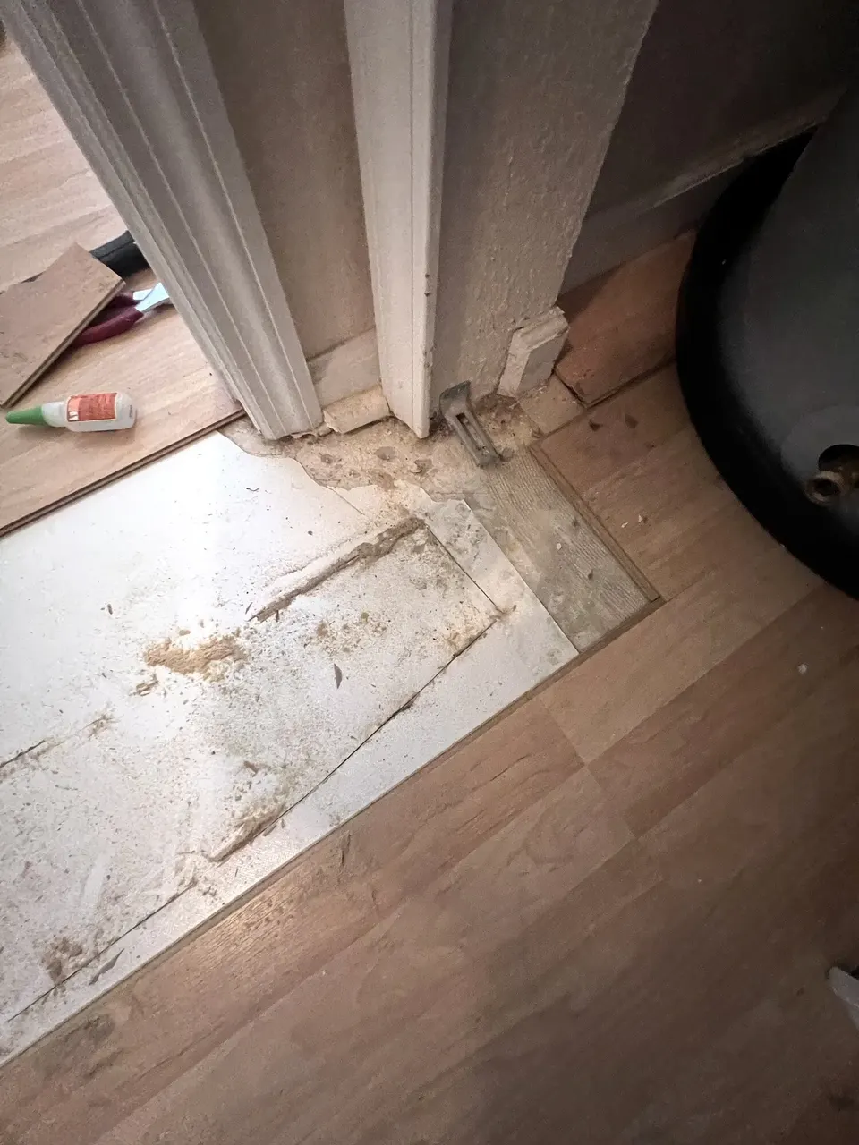 Second water-damaged area prepared for matching laminate planks
