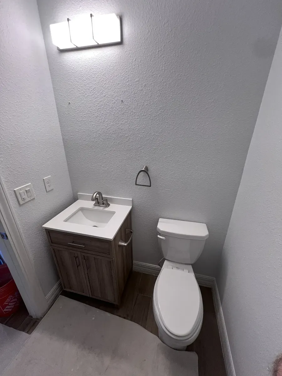 Existing floor-standing vanity before removal