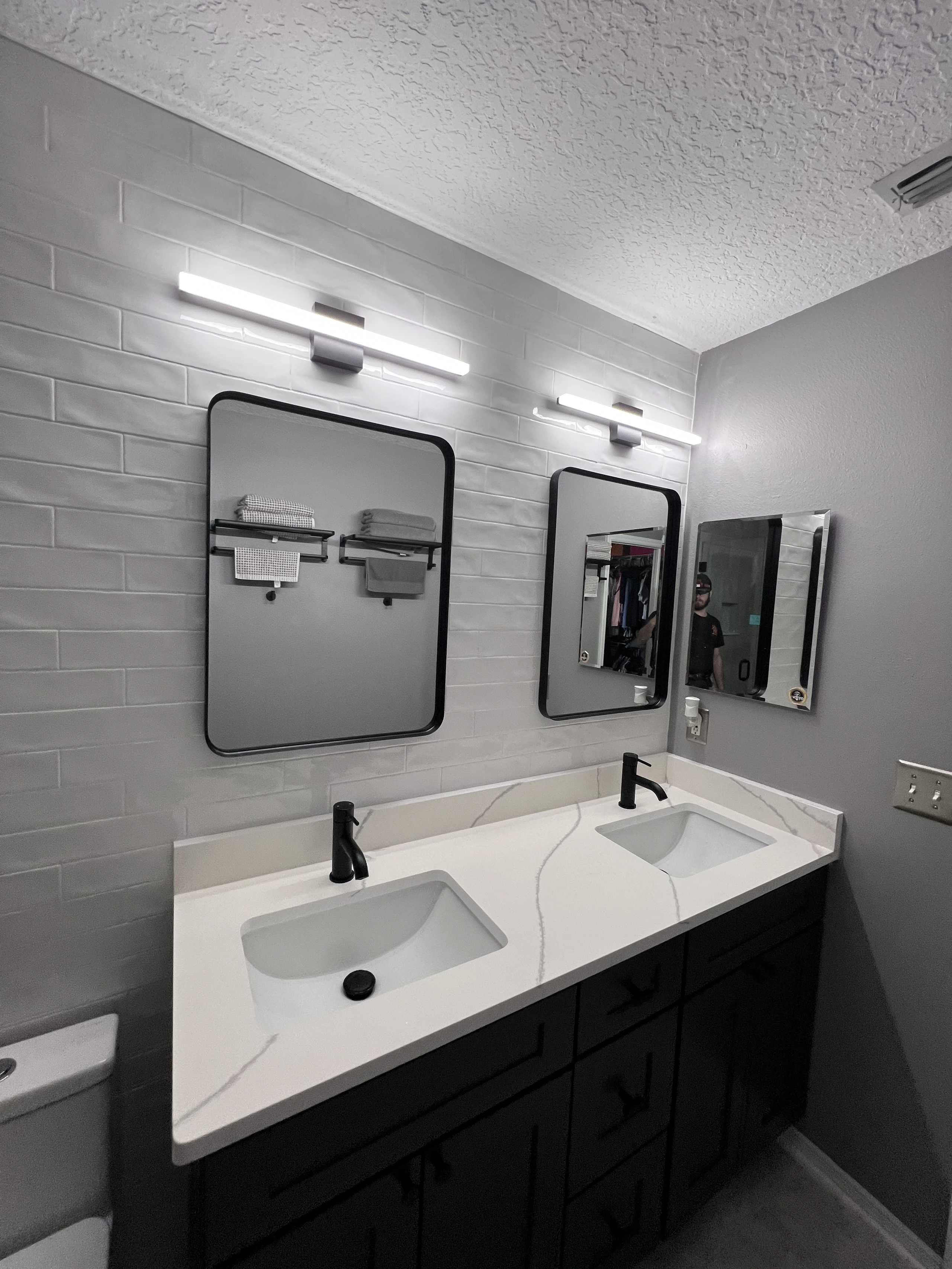 Finished pair of bathroom mirrors installed over a double vanity in Jacksonville, Florida