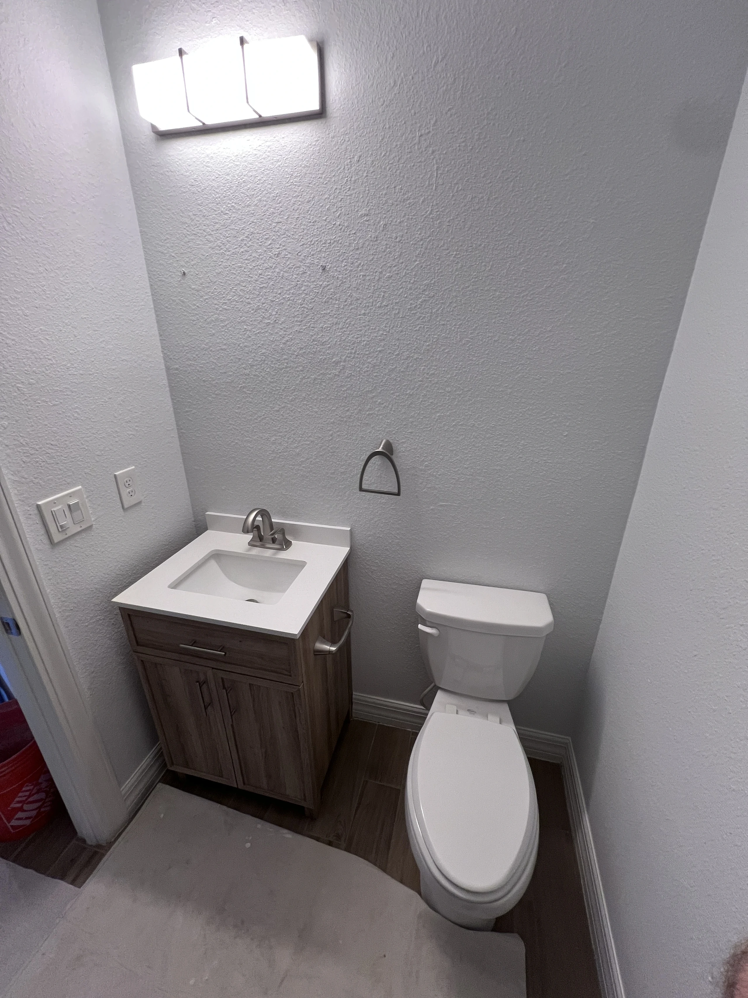 Existing floor-standing vanity before removal