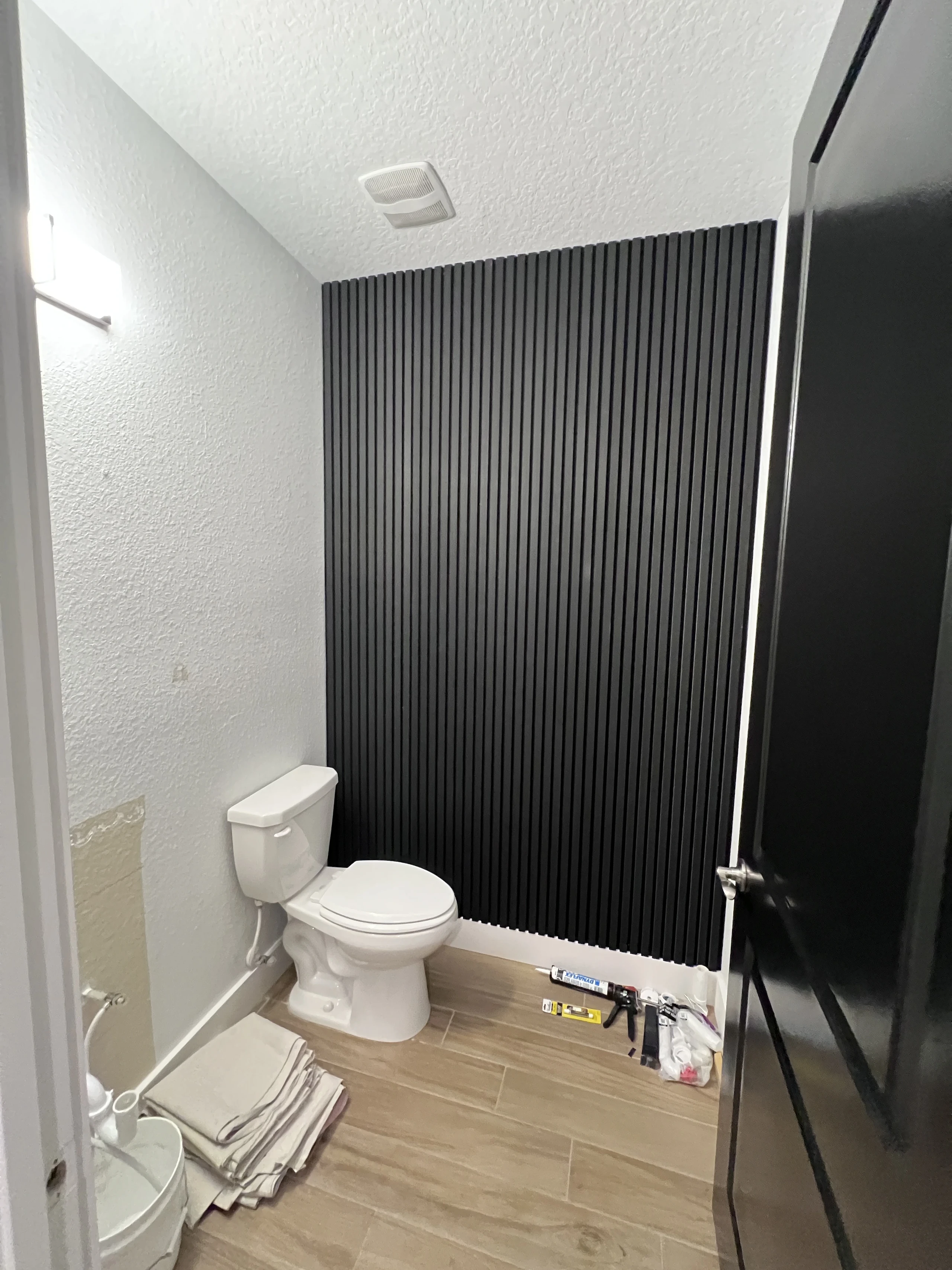 Half bath prepared for the feature wall and vanity installation