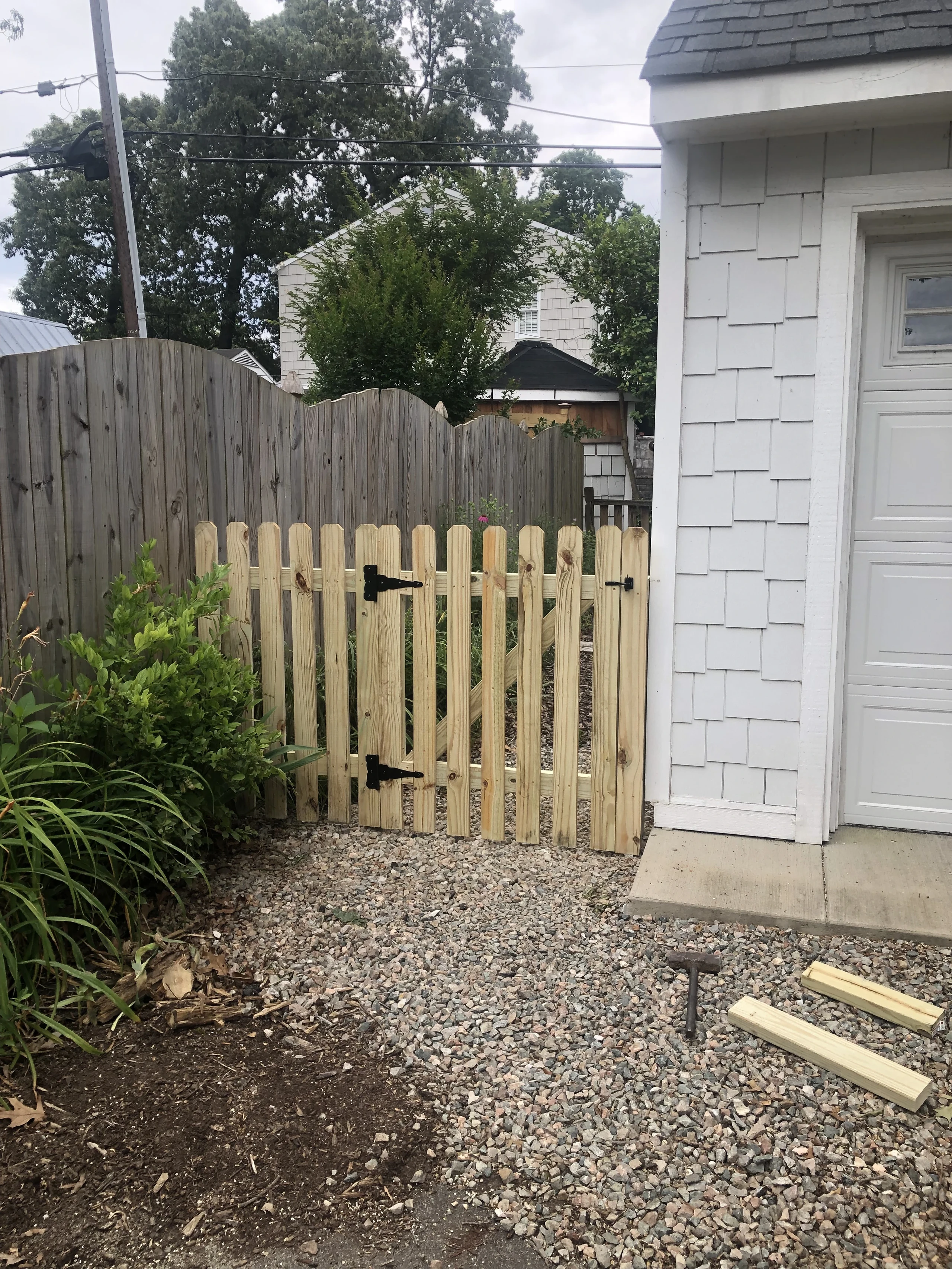 Fence and gate repair with wood gate sections in Jacksonville, FL