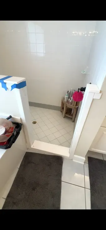 Shower entry before the threshold and partition repair