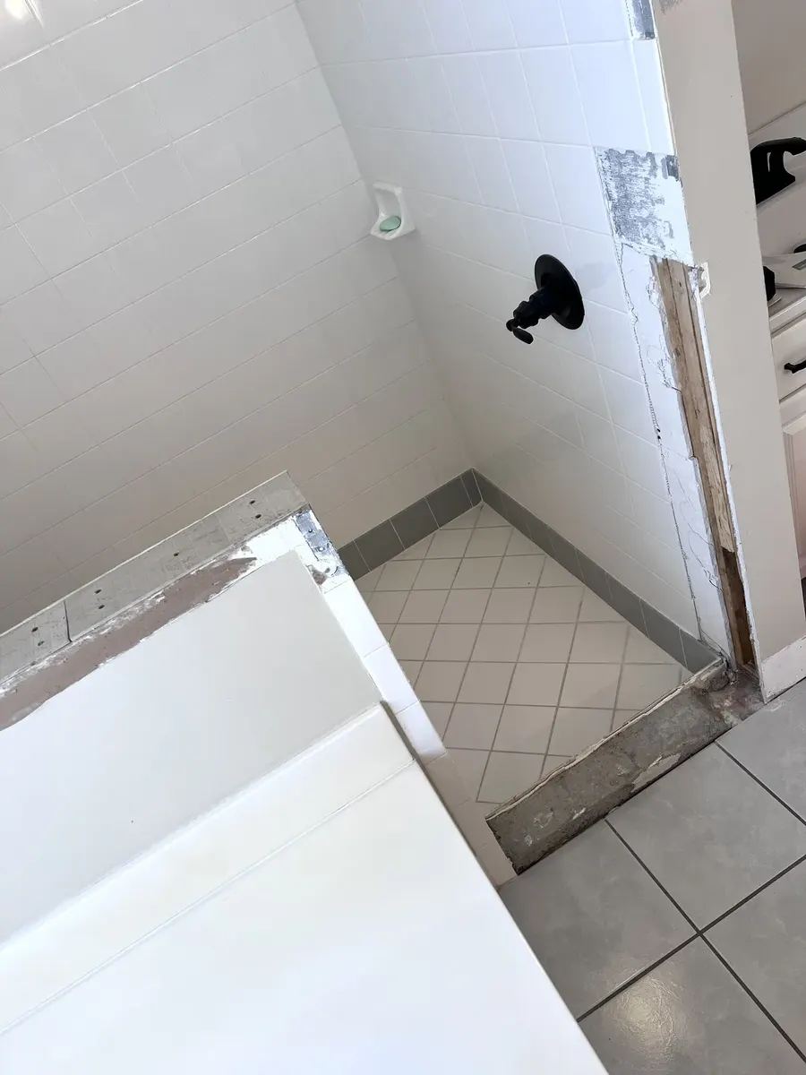 Stone and tile installation during the shower entry repair