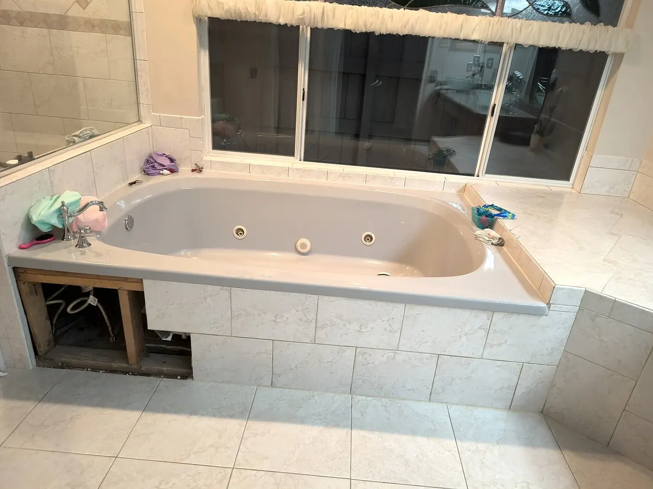 Open tub plumbing access before the tiled panel was built