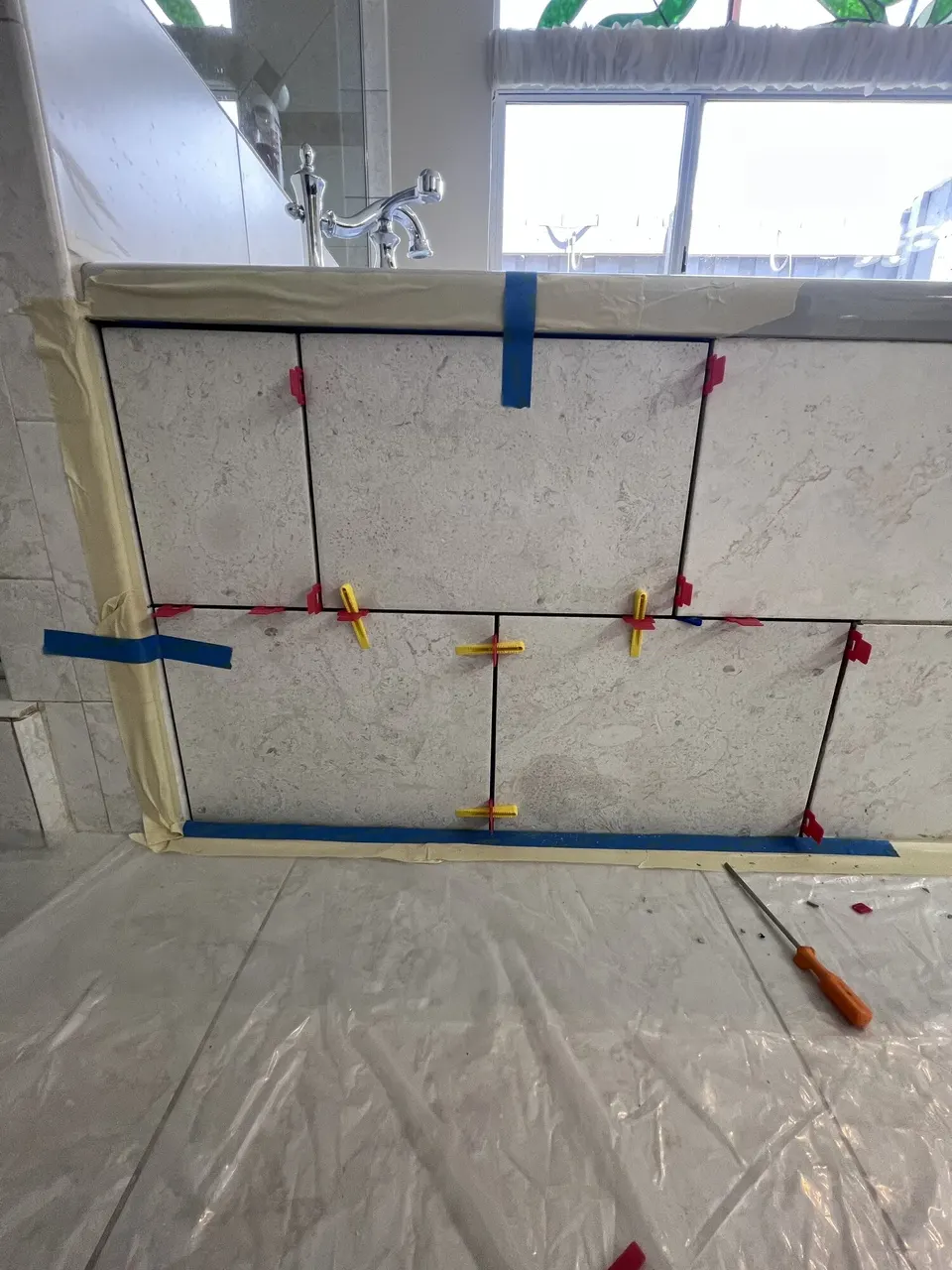 Tile layout progressing across the access panel