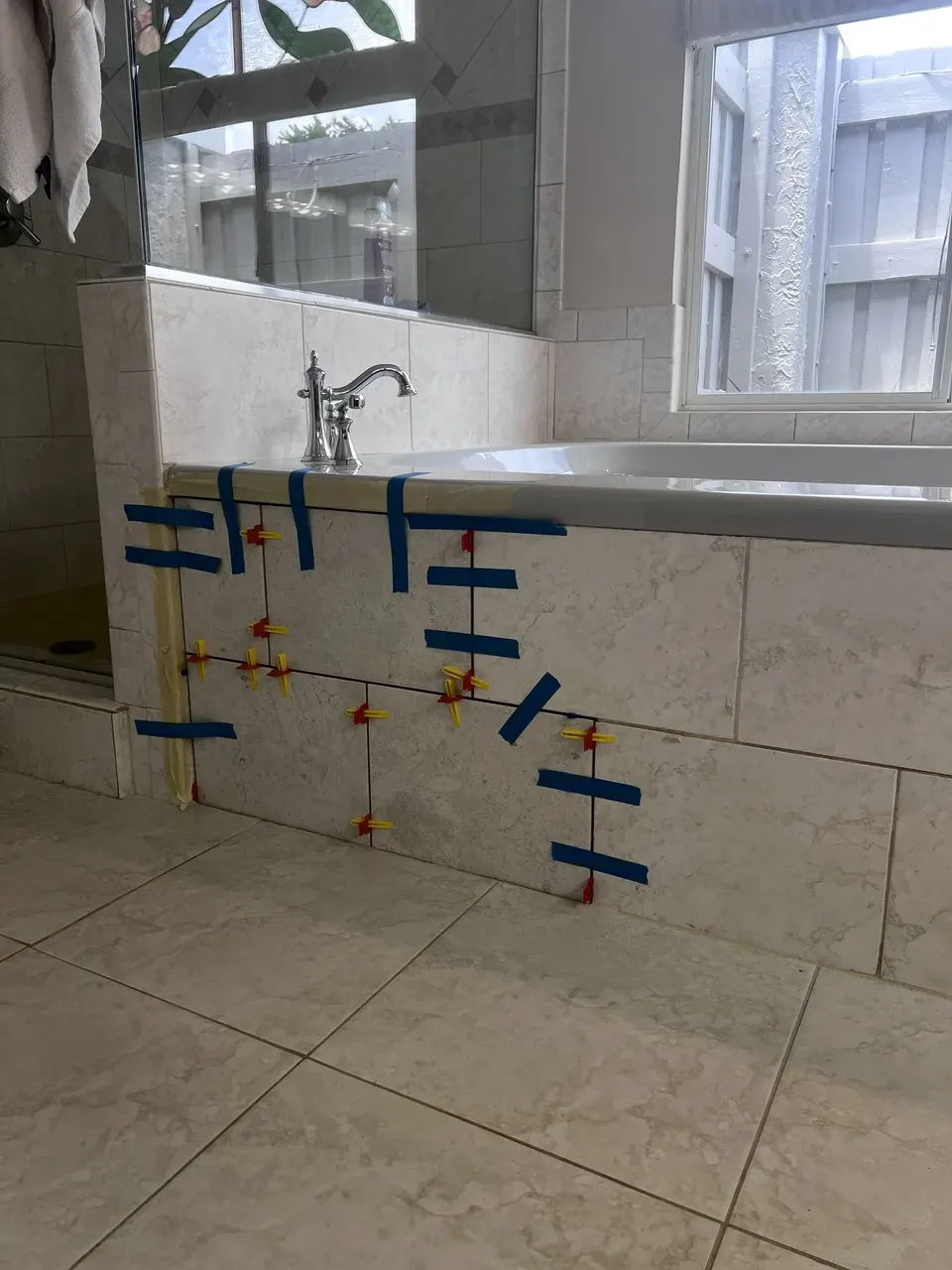 Access panel tile held in alignment during installation