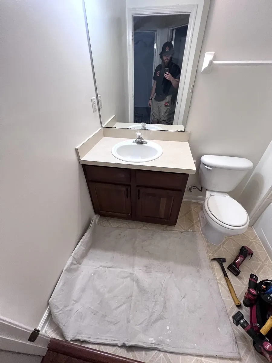 Bathroom vanity and flooring before the update