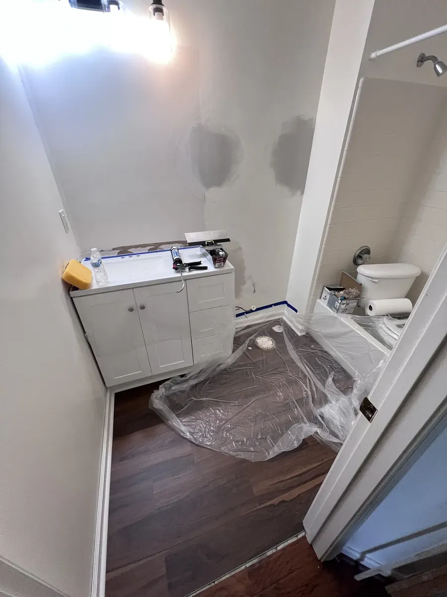 LVP flooring installation during the hall bathroom update