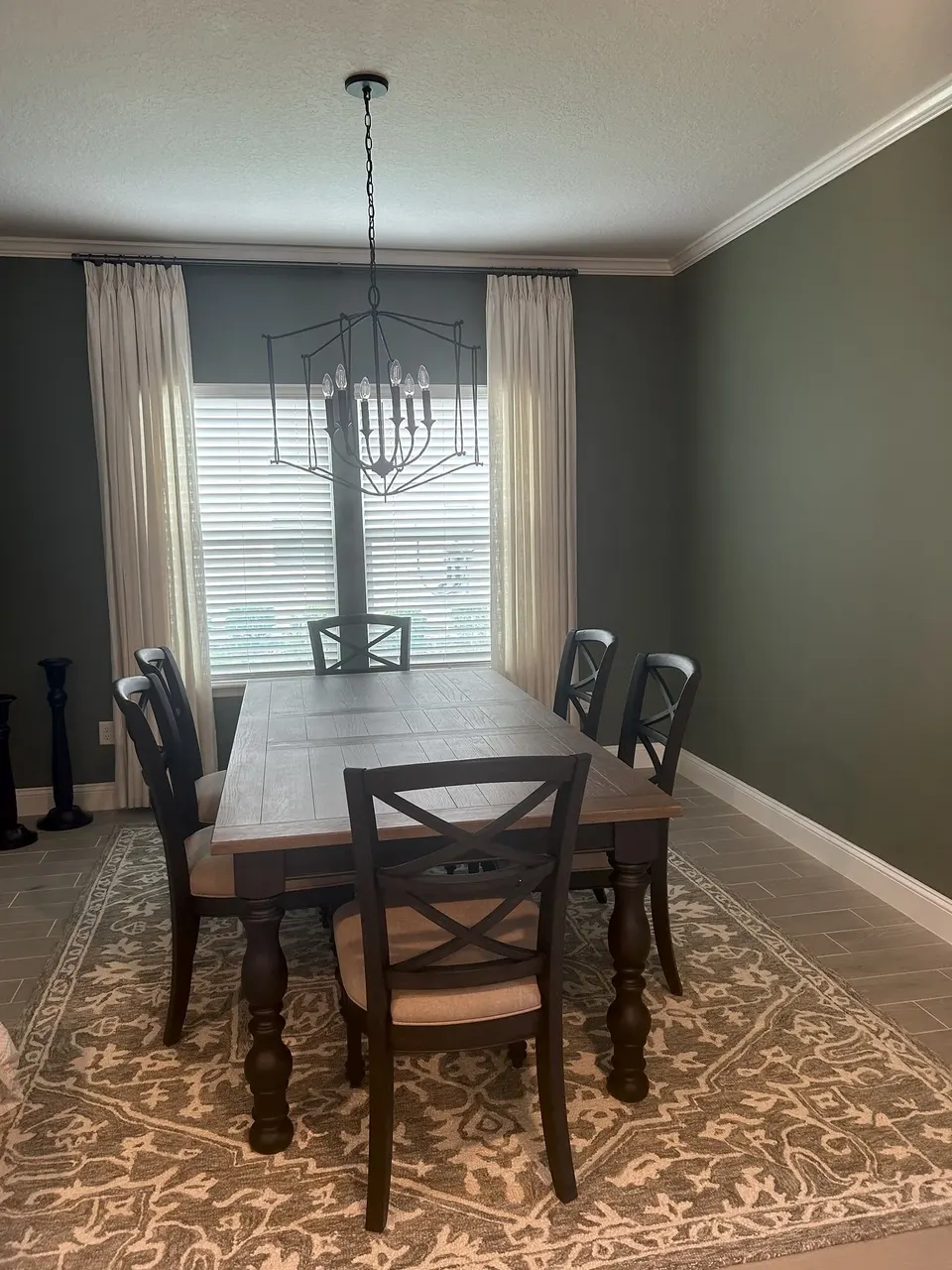 Finished dining room chandelier and window treatments in Yulee, Florida